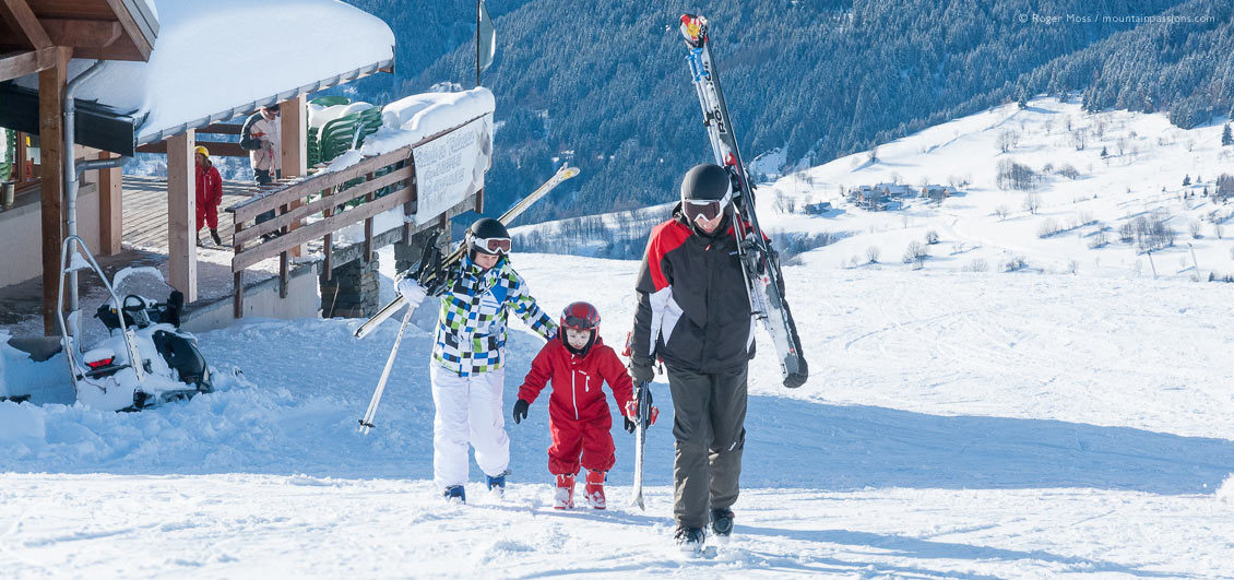 Family skiers at Saint-Francois Longchamp, French Alps