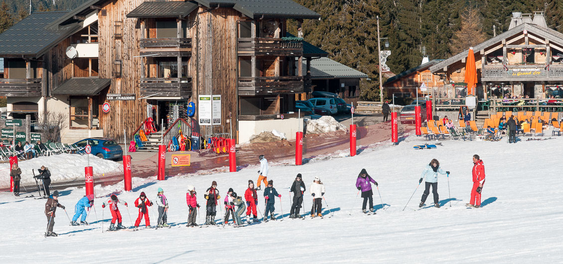 Young skiers ski lesson with ESF monitor, Les Gets, Portes du Soleil
