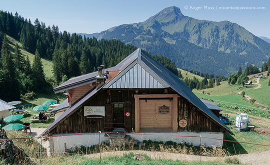 View of chalet restaurant with with mountains above Chatel