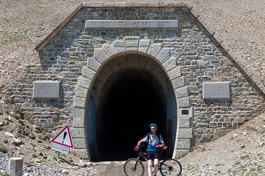 Roger Moss with mountain bike in front of Tunnel du Parpaillon