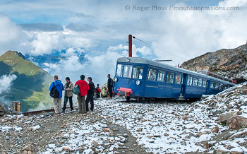 Visitors at high mountain viewpoint beside the Tramway du Mont-Blanc