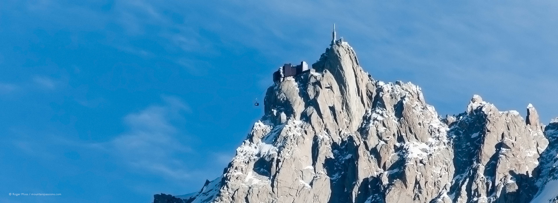 Distant view of Aiguille du Midi cable-car and summit