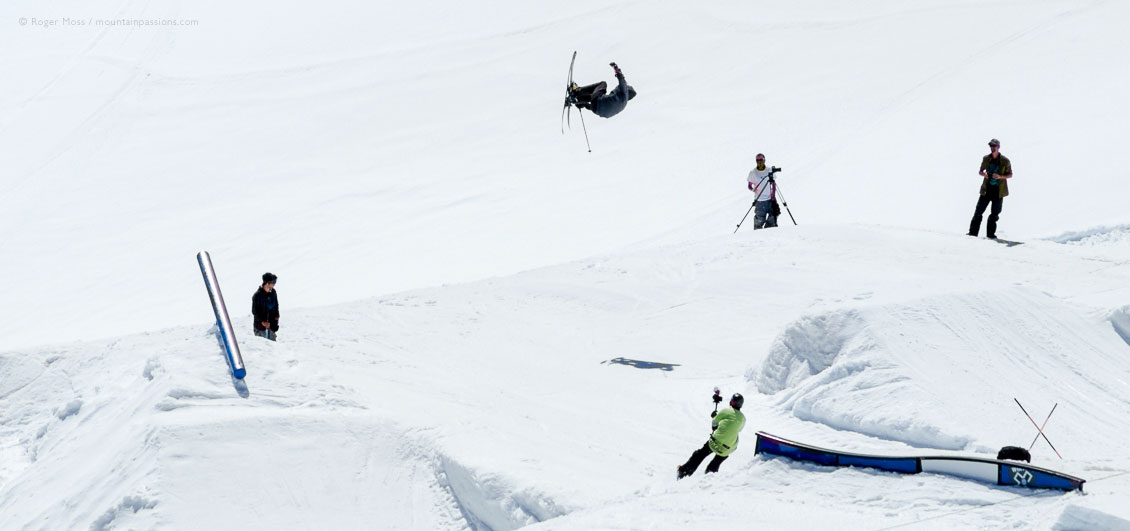 High view of freestyle skier in snowpark on glacier in summer, at Tignes