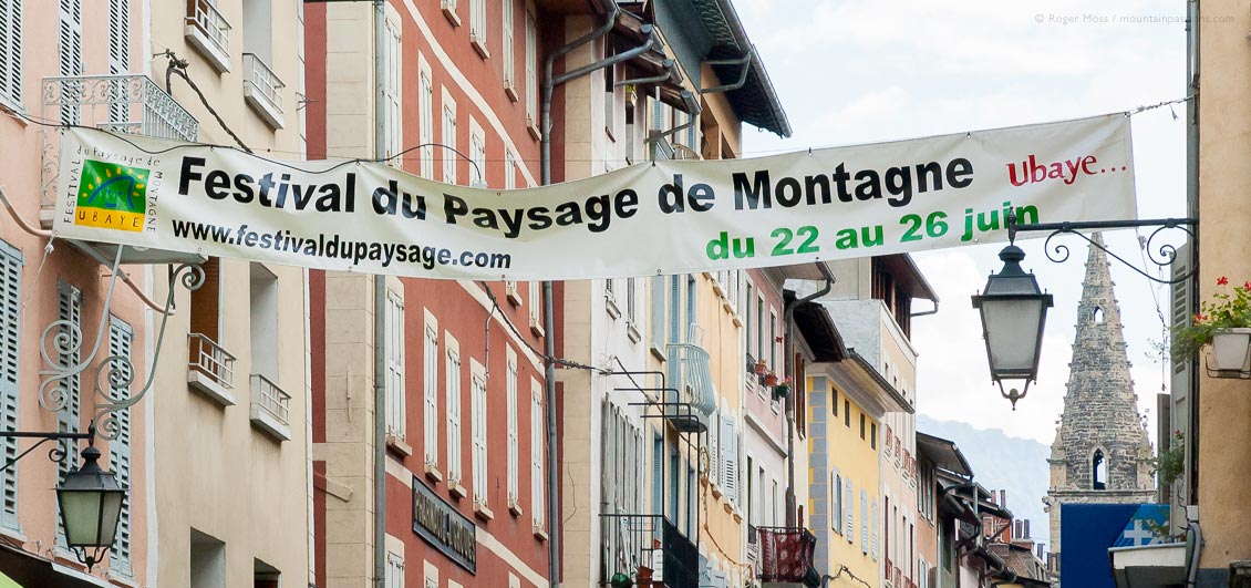 View of mountain festival banner across street in Barcelonnette