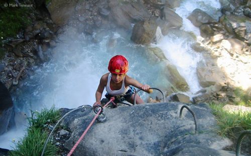 via ferrata above waterfall, French Alps