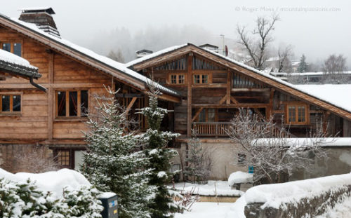 Renovated chalets in winter at Les Carroz, French Alps.