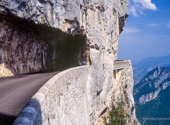 View of high mountain road with tunnel in Vercors