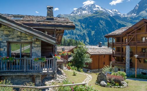 View through village chalets to mountains, Sainte-Foy-Tarentaise