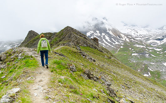 Walker on footath near Tovieres gondola, Tignes