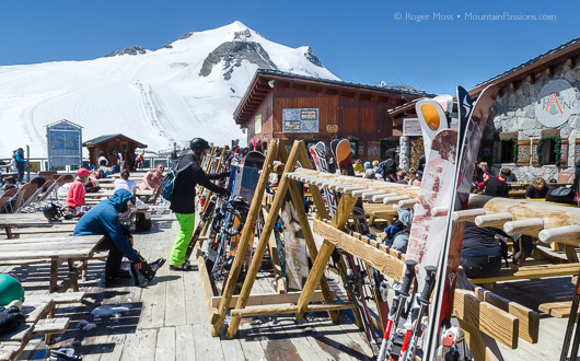 Grande Motte glacier, restaurant terrace with ski racks, view to mountain