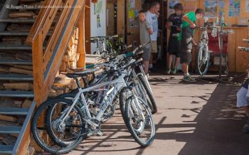 Interior of mountain bike hire shop with visitors