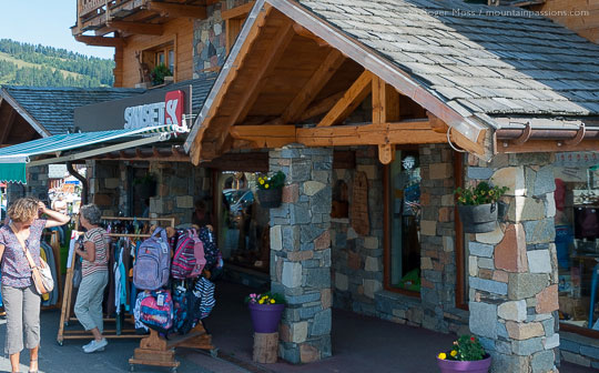 Summer visitors outside sports shop in Les Saisies