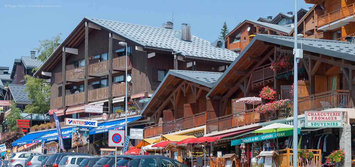 Low view of chalet-style boutiques and apartments in village centre of Les Saisies