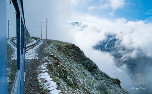 Chamonix is visible far below the Tramway du Mont Blanc on it's ascent to the Nid d'Aigle