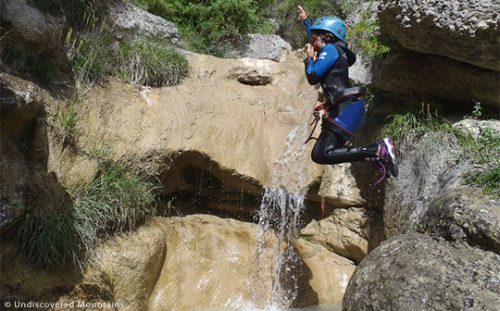 Canyoning suits all ages as long as you can swim. Here a child abseils while canyoning in the southern French Alps.