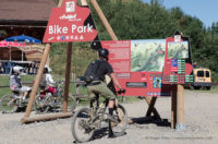 Mountain biker looking at map of Chatel bike park