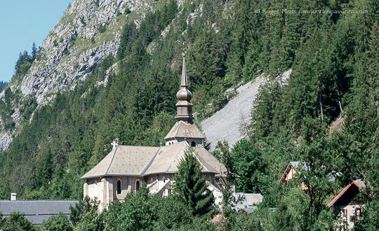 Distant view of the Abbaye d'Abondance and mountainside, French Alps