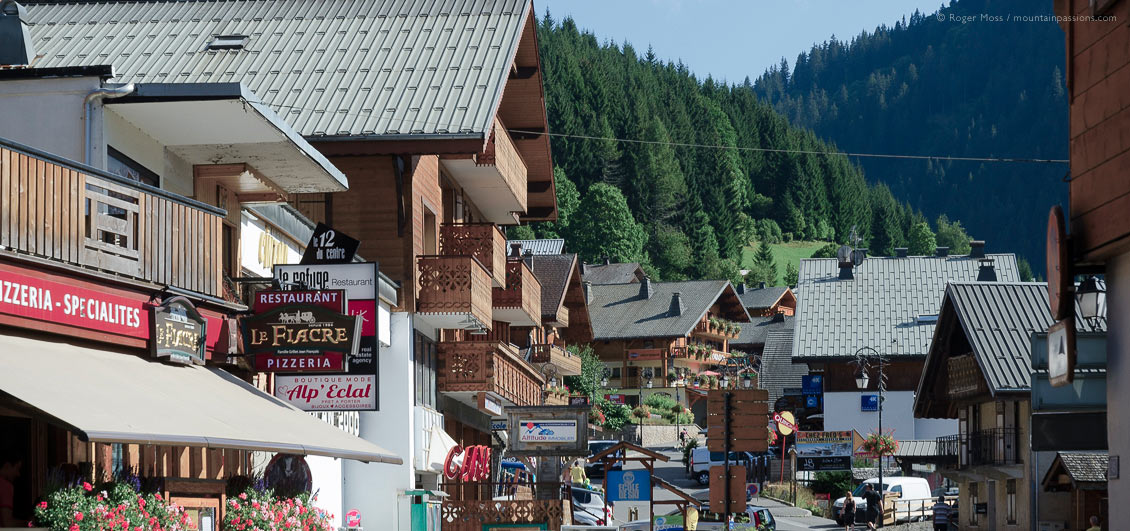 Low view of Chatel village street in summer with mountains in background