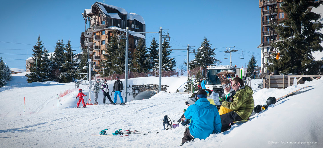 Young skiers pinicking beside piste in ski resort of Avoriaz, French Alps