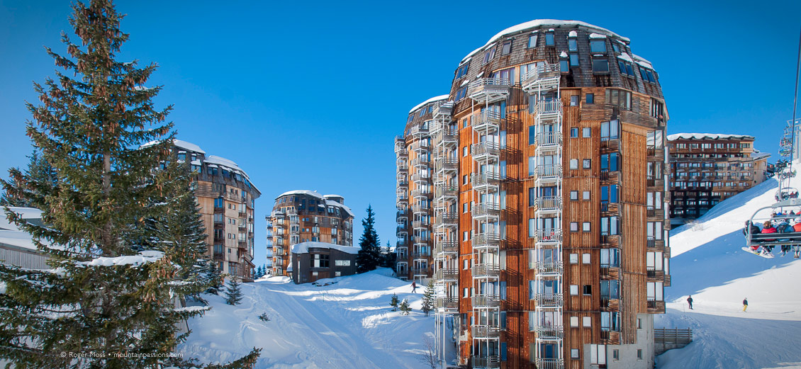 Skier's-eye view from chairlift passing apartment blocks in Avoriaz, Portes du Soleil, French Alps.