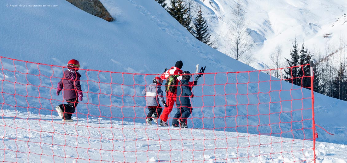 Group of young skiers with ESF ski instructor