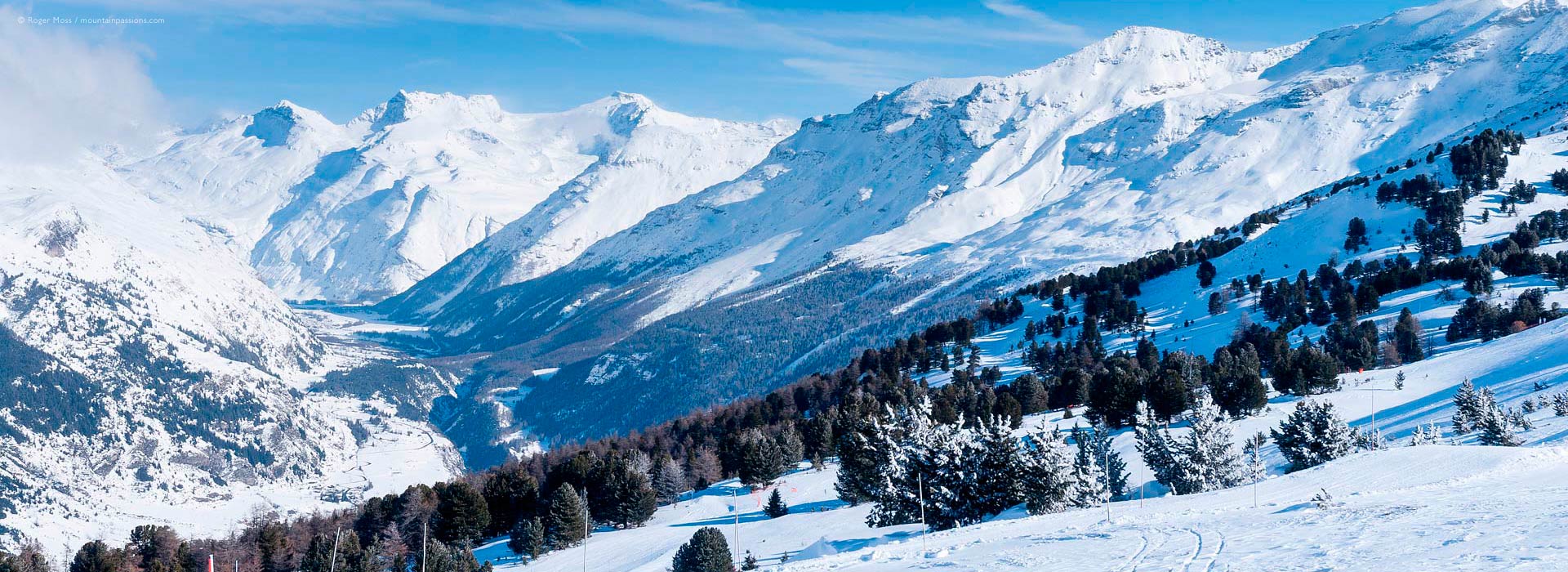 Wide view of mountainside with snow-covered Haute Maurienne valley at Val Cenis Vanoise