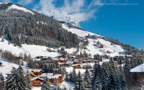 La Clusaz - View across valley to snow-covered mountainside with chalets