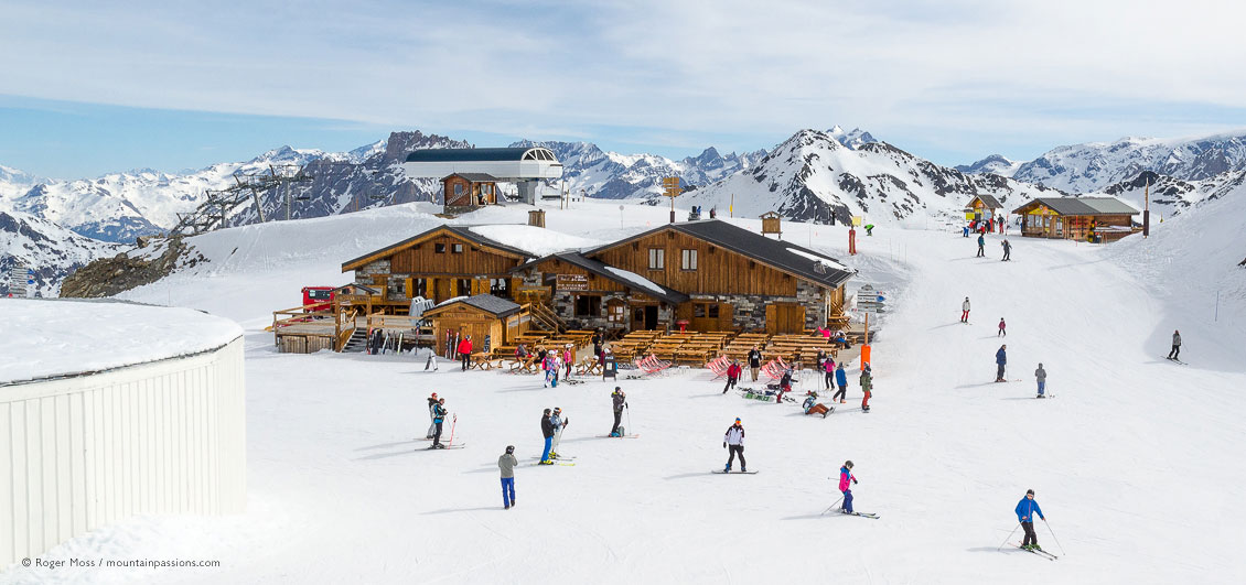 Skiers around mountain restaurant