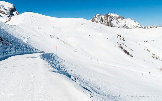 Wide view from ski piste of mountain with ski lift