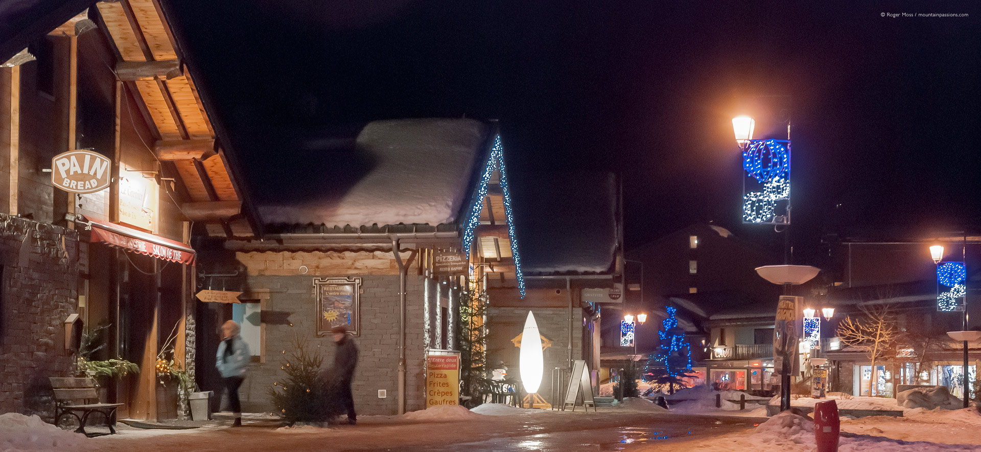 Evening in village centre, showing bars and shops.