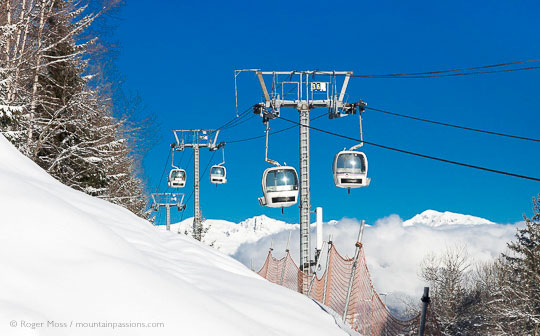 View of gondola ski lift with snow-covered mountainside