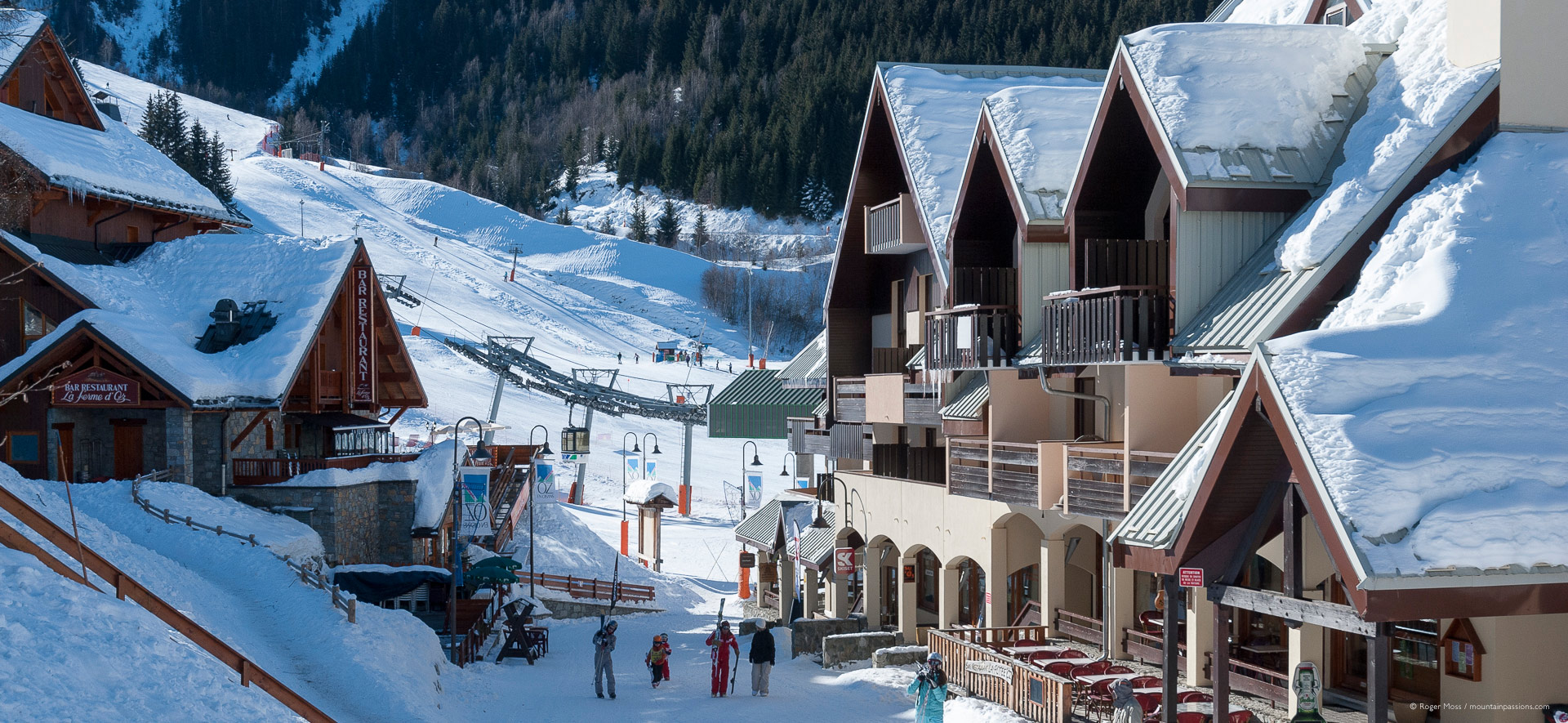 View through ski village to mountainside with visitors