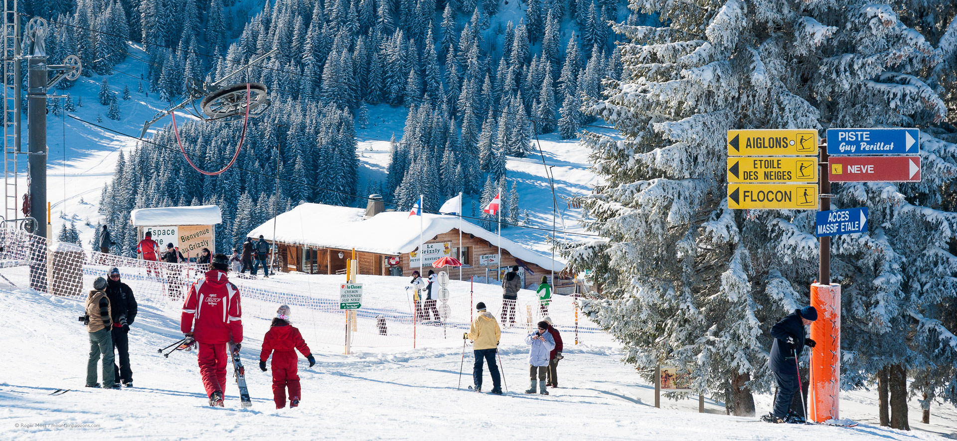 Skiers and ski instructor around debutant area in La Clausaz ski area