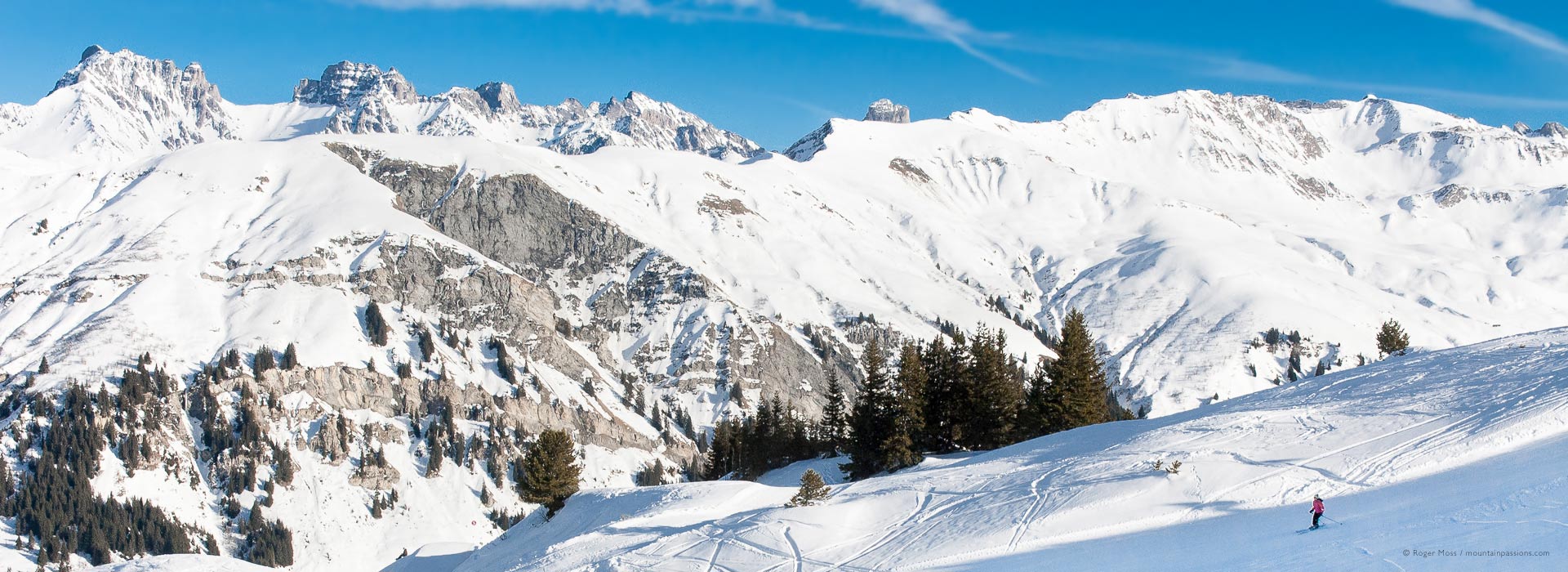 Wide view of skier on piste above Arêches-Beaufort ski resort