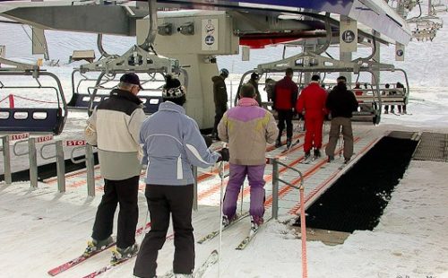 Loading area of a six-seater magic-carpet chair-lift in Tignes, in the Espace Killy (French Alps).