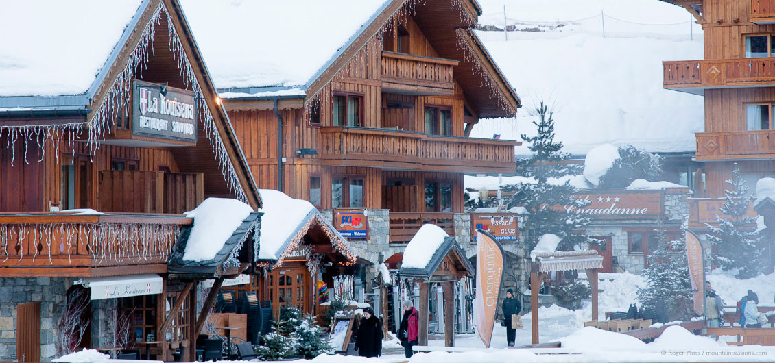 Visitors among ski boutique and hotels at Meribel