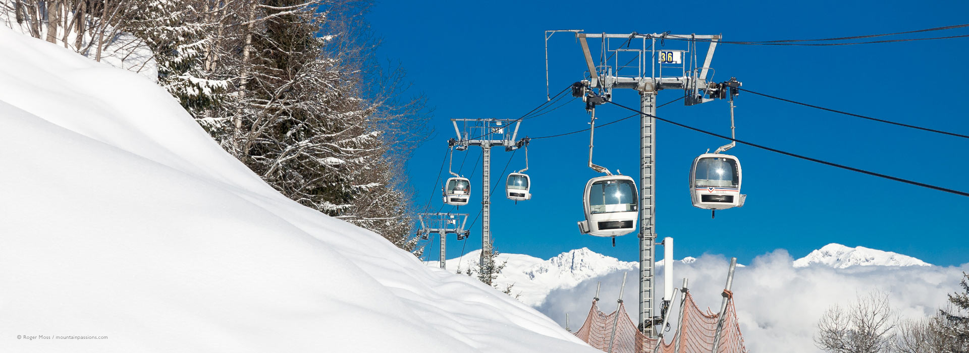 Olympe gondola lift from Brides-les-Bains, with fresh snow at Meribel..