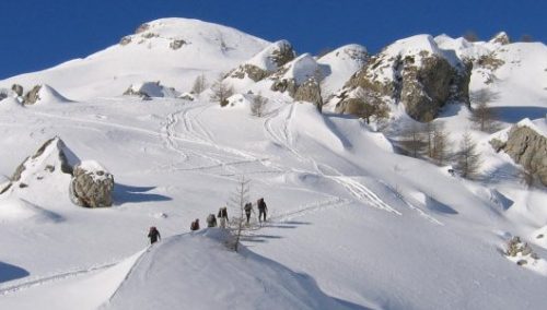 Ski touring group ascending to Palastre.