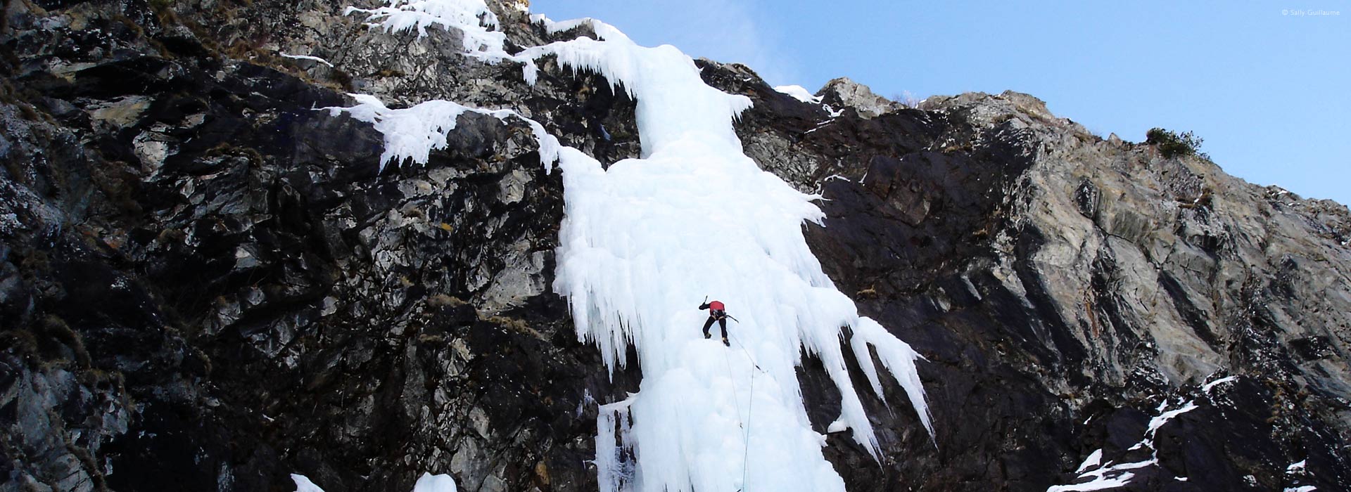 ice-climbing on frozen waterfall