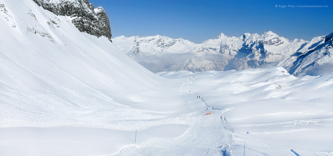 Wide valley with distant skier in huge mountain landscape above Flaine, Grand Massif