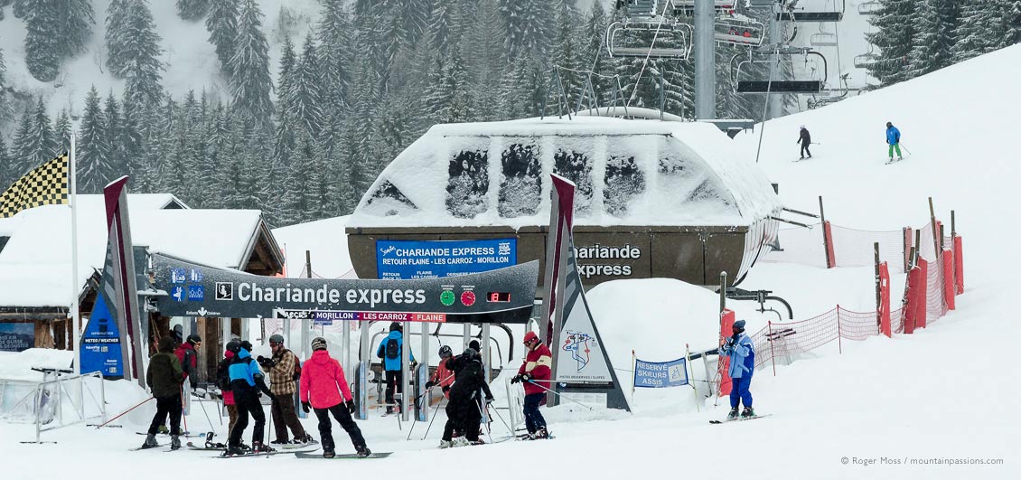 Skiers joining ski lift at Samoens 1600, Grand Massif, French Alps.