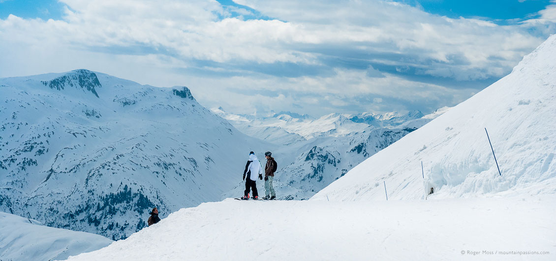 Two snowboarders with big mountain view at Les Contamines