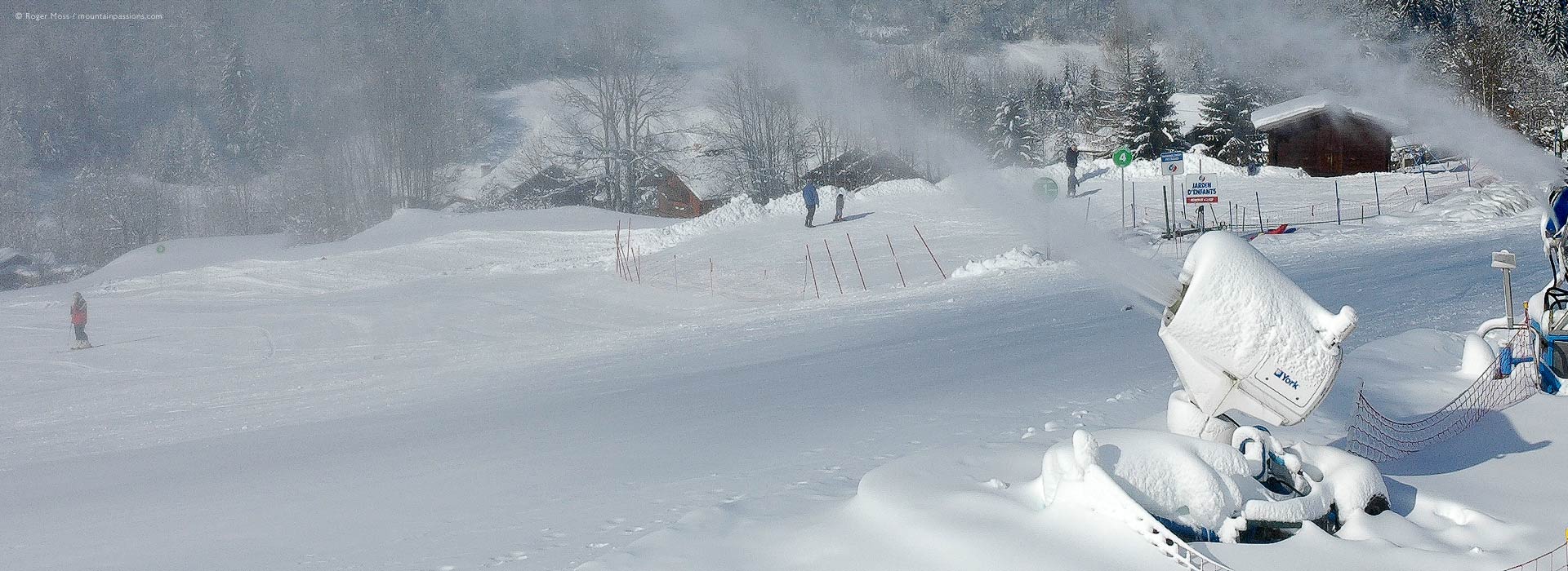 Artificial snowmaking beside ski piste at Sixte-Fer-A-Cheval, Grand Massif ski area, French Alps.