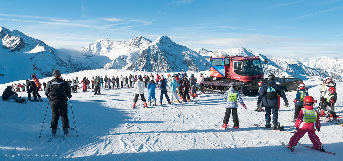 Wide view of young skiers gathered for ski lessons at Peyragudes, French Pyrenees