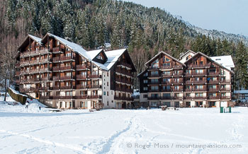 View across snow to Balcons du Savoy chalet-style apartments