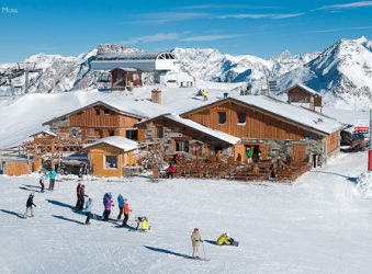 Skiers and chalets, Les Menuires, Three Valleys, French Alps