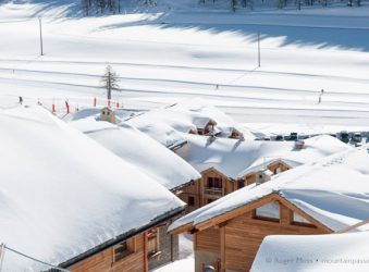 The Obelisque area accommodation rooftops with snow, Montgenevre, French Alps