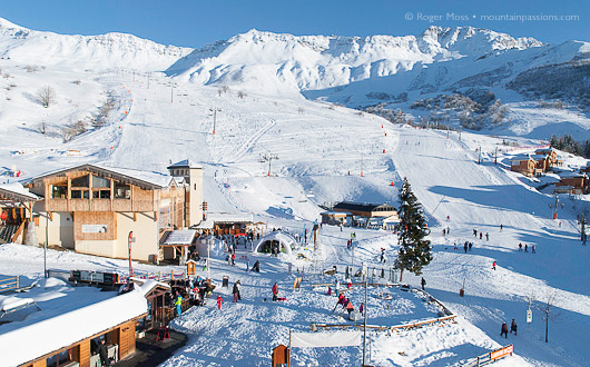 The lifts are closing, shadows lengthen and skiers return to the front de niege at Saint-Francois-Longchamp, to share their day's experiences with friends.