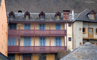Argeles-Gazost, colourful building with balconies.