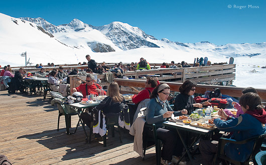 Diners enjoy the sun terrace of the Chalet de Rocherousse, Orcieres.